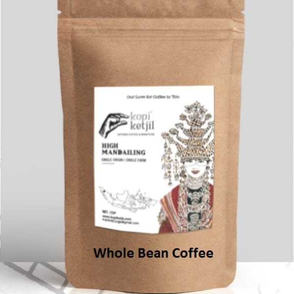 A brown bag of Kopi Ketjil High Mandailing whole bean coffee with an illustrated label.