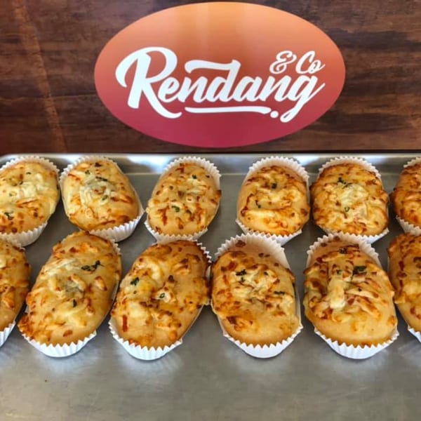 A tray of Rendang & Co's savory Indonesian pastries with cheese and herbs.